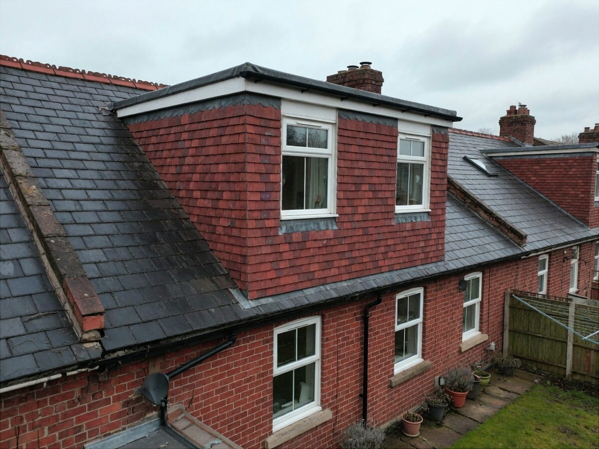 Rear box dormer loft conversion with hanging tiles on a brick terrace